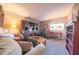 Comfortable living room featuring neutral walls, plush seating, and an efficient home office nook at 1057 Timber Creek Dr # 1, Carmel, IN 46032
