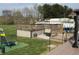 Expansive backyard with a multi-level deck, above-ground pool, and trampoline offers fun and relaxation at 1130 W State Road 42, Mooresville, IN 46158