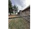 View of the backyard and a black chain link fence at 1130 W State Road 42, Mooresville, IN 46158