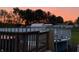 Serene backyard view with vibrant sky, above-ground pool, and wooden fencing at 1130 W State Road 42, Mooresville, IN 46158