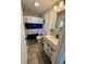 Neat bathroom featuring a modern vanity and striped shower curtain offers style and functionality at 1130 W State Road 42, Mooresville, IN 46158
