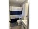 This bathroom features a toilet, shower, and a vanity with a sink at 1130 W State Road 42, Mooresville, IN 46158