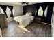 A primary bedroom featuring natural light, a ceiling fan, and minimalist decor at 1130 W State Road 42, Mooresville, IN 46158