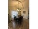 Cozy dining room with pendant lighting, hardwood floors, and access to backyard at 1130 W State Road 42, Mooresville, IN 46158
