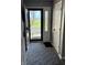 Inviting entryway with decorative glass sidelight and view to the exterior at 1130 W State Road 42, Mooresville, IN 46158
