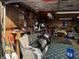 View of a garage, showcasing its organized storage solutions, work benches, tools, and recreational equipment at 1130 W State Road 42, Mooresville, IN 46158