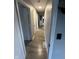Neutral-toned hallway with updated flooring and access to multiple rooms in the home at 1130 W State Road 42, Mooresville, IN 46158