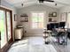 Sunlit home office with desk, shelves, and backyard view at 1130 W State Road 42, Mooresville, IN 46158