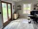 Airy office with desk, shelves, and view of the backyard at 1130 W State Road 42, Mooresville, IN 46158
