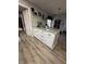 Bright kitchen showcasing a white island with granite countertops, ample storage, and modern appliances at 1130 W State Road 42, Mooresville, IN 46158