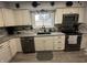 Bright kitchen with granite countertops, stainless steel appliances, and stylish backsplash at 1130 W State Road 42, Mooresville, IN 46158
