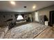 A view of the living room from the opposite angle highlighting the gray walls and comfortable furniture at 1130 W State Road 42, Mooresville, IN 46158