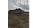 View of an outbuilding with a gray cloudy sky, adding extra storage space or a workshop at 1130 W State Road 42, Mooresville, IN 46158