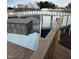View of an above-ground swimming pool with a wooden deck, ready for summer enjoyment at 1130 W State Road 42, Mooresville, IN 46158