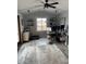 Bright sun room with multiple windows, vaulted ceilings and laminate flooring at 1130 W State Road 42, Mooresville, IN 46158