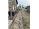 A stone paver walkway with a stone border and a step leading to a spacious backyard at 1130 W State Road 42, Mooresville, IN 46158