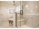 Elegant bathroom featuring a marble shower with a glass door and a stylish chandelier at 15432 Heatherbank Dr, Westfield, IN 46074