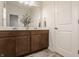 Bathroom featuring a double sink vanity with wood cabinets and decorative accents at 15432 Heatherbank Dr, Westfield, IN 46074