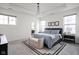 Bright bedroom featuring a large bed with a blue striped comforter at 15432 Heatherbank Dr, Westfield, IN 46074