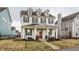 Beautiful two-story home with classic design, covered porch, and a neatly landscaped yard at 15432 Heatherbank Dr, Westfield, IN 46074