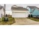 Detached two-car garage featuring white siding, carriage lights and concrete driveway at 15432 Heatherbank Dr, Westfield, IN 46074