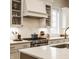Close-up of kitchen details: custom cabinetry, stainless steel range, and quartz countertops at 15432 Heatherbank Dr, Westfield, IN 46074