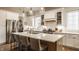 Well-appointed kitchen with quartz countertops, stainless steel appliances, and island with bar seating at 15432 Heatherbank Dr, Westfield, IN 46074