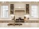 Close-up of gourmet kitchen featuring quartz countertops, custom cabinetry, and premium appliances at 15432 Heatherbank Dr, Westfield, IN 46074