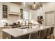 Modern kitchen with a large center island, stainless appliances, and stylish pendant lights at 15432 Heatherbank Dr, Westfield, IN 46074