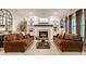 Cozy living room features a fireplace with custom built-ins, comfortable seating, and stylish decor at 15432 Heatherbank Dr, Westfield, IN 46074