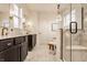 Luxurious main bathroom showcasing a double vanity, marble floors, and a glass-enclosed shower at 15432 Heatherbank Dr, Westfield, IN 46074