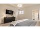 Comfortable main bedroom featuring a TV, nightstand, and a view into the main bathroom at 15432 Heatherbank Dr, Westfield, IN 46074