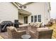Outdoor patio with wicker seating, dining table, and a grill, perfect for entertaining at 15432 Heatherbank Dr, Westfield, IN 46074