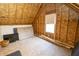 Unfinished attic space with exposed beams and plywood walls, awaiting conversion into functional space at 15921 Herriman Blvd, Noblesville, IN 46060