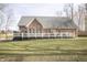 Large backyard with an expansive deck, ideal for outdoor activities and relaxation at 15921 Herriman Blvd, Noblesville, IN 46060