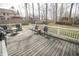 Wooden deck perfect for outdoor enjoyment, featuring patio furniture and a white railing in fenced backyard at 15921 Herriman Blvd, Noblesville, IN 46060