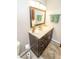 Contemporary bathroom featuring a vanity with granite countertop, dark wood cabinets, and modern lighting at 15921 Herriman Blvd, Noblesville, IN 46060