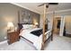 Bedroom featuring a ceiling fan, four poster bed and large walk in closet at 15921 Herriman Blvd, Noblesville, IN 46060