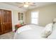 Bright bedroom with a closet, a window for natural light, and simple decor for comfortable living at 15921 Herriman Blvd, Noblesville, IN 46060