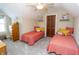 Bright bedroom featuring two beds, natural lighting, and decor at 15921 Herriman Blvd, Noblesville, IN 46060