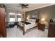 Spacious bedroom with a four poster bed, ceiling fan and carpet at 15921 Herriman Blvd, Noblesville, IN 46060