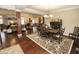 Open dining room with wood floors and easy access to living areas at 15921 Herriman Blvd, Noblesville, IN 46060