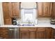 Updated kitchen showcasing stainless steel appliances, counter space, and wood cabinets at 15921 Herriman Blvd, Noblesville, IN 46060