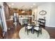 Kitchen dining area with a glass table and a view of the stainless steel appliances at 15921 Herriman Blvd, Noblesville, IN 46060