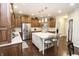 Well-lit kitchen featuring a center island with bar seating and stainless steel appliances at 15921 Herriman Blvd, Noblesville, IN 46060