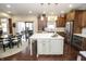 Modern kitchen with a center island, stainless steel appliances, and sliding glass doors at 15921 Herriman Blvd, Noblesville, IN 46060