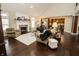 Bright living room featuring a fireplace and hardwood flooring throughout at 15921 Herriman Blvd, Noblesville, IN 46060