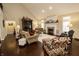 Spacious living room featuring a fireplace, hardwood floors, and comfortable seating at 15921 Herriman Blvd, Noblesville, IN 46060