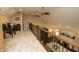 Spacious loft area overlooking the living room with black iron railing at 15921 Herriman Blvd, Noblesville, IN 46060