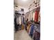 Walk-in closet with custom shelving and ample storage for clothing and shoes at 15921 Herriman Blvd, Noblesville, IN 46060